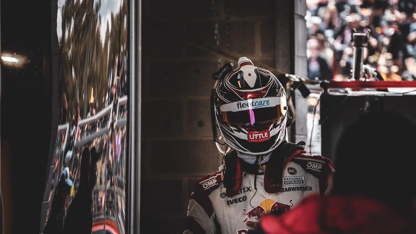 Race driver in a helmet in the pit lane at Bathurst
