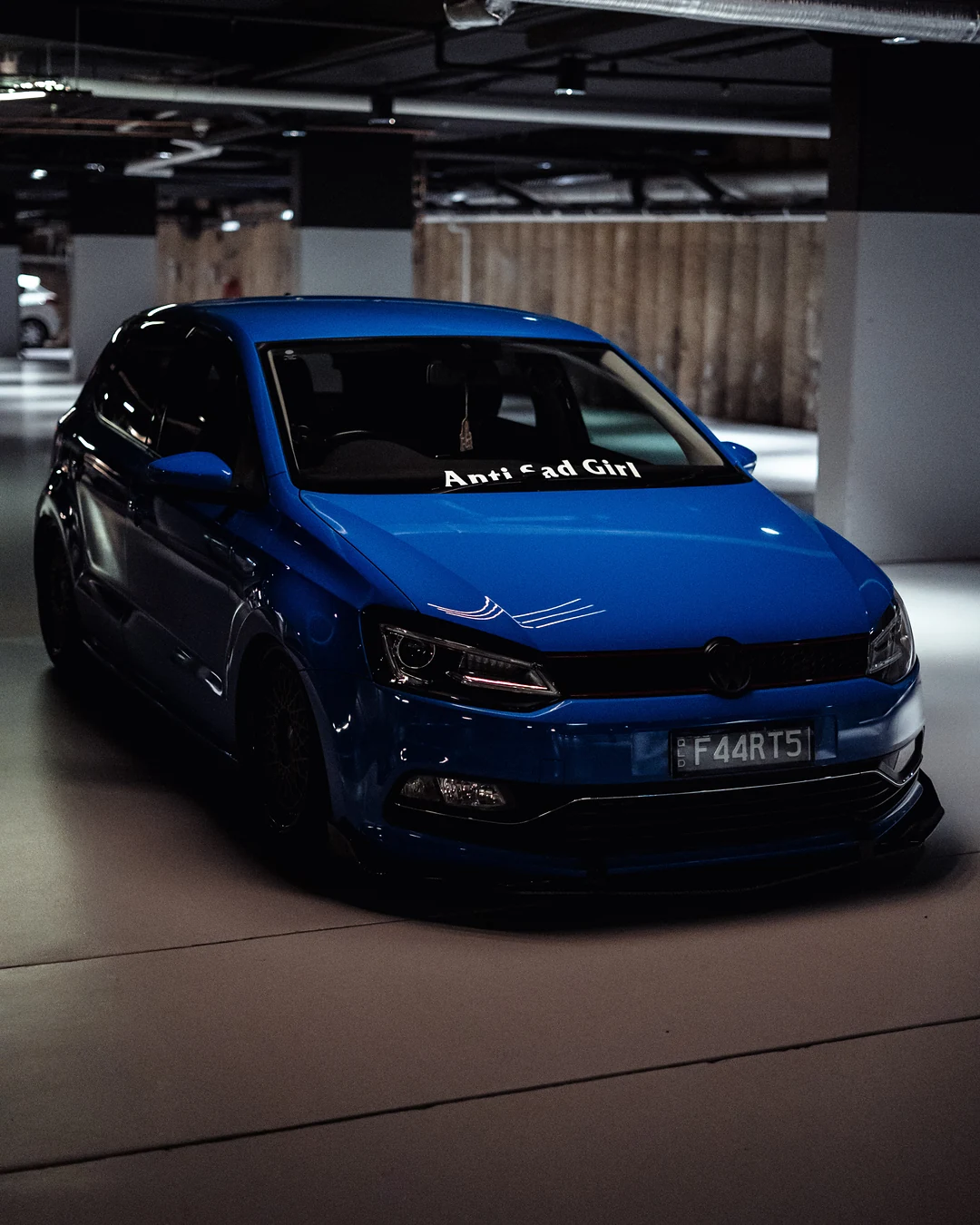 Blue Volkswagen Polo in an underground car park